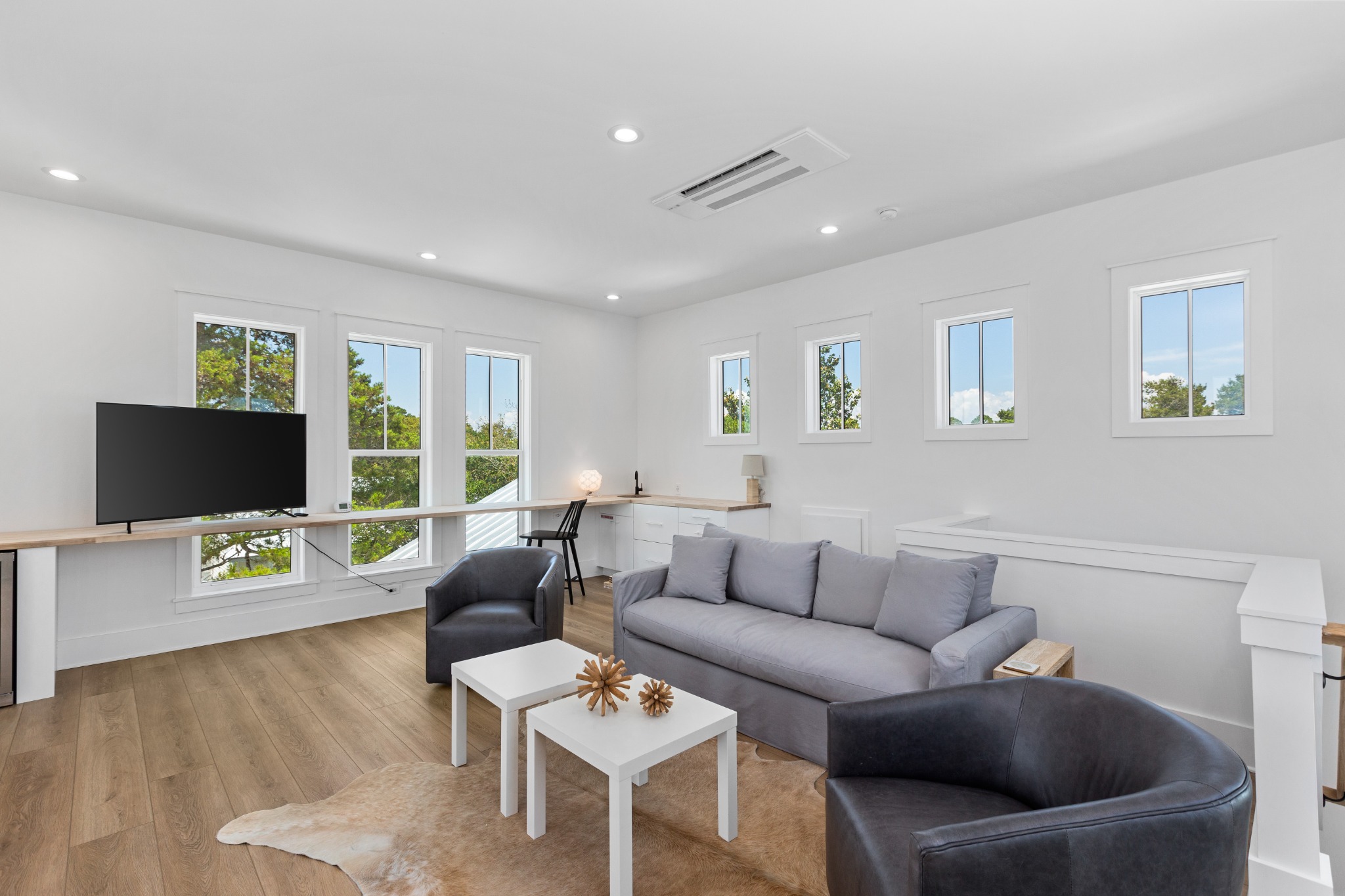 Lounge with TV and large windows