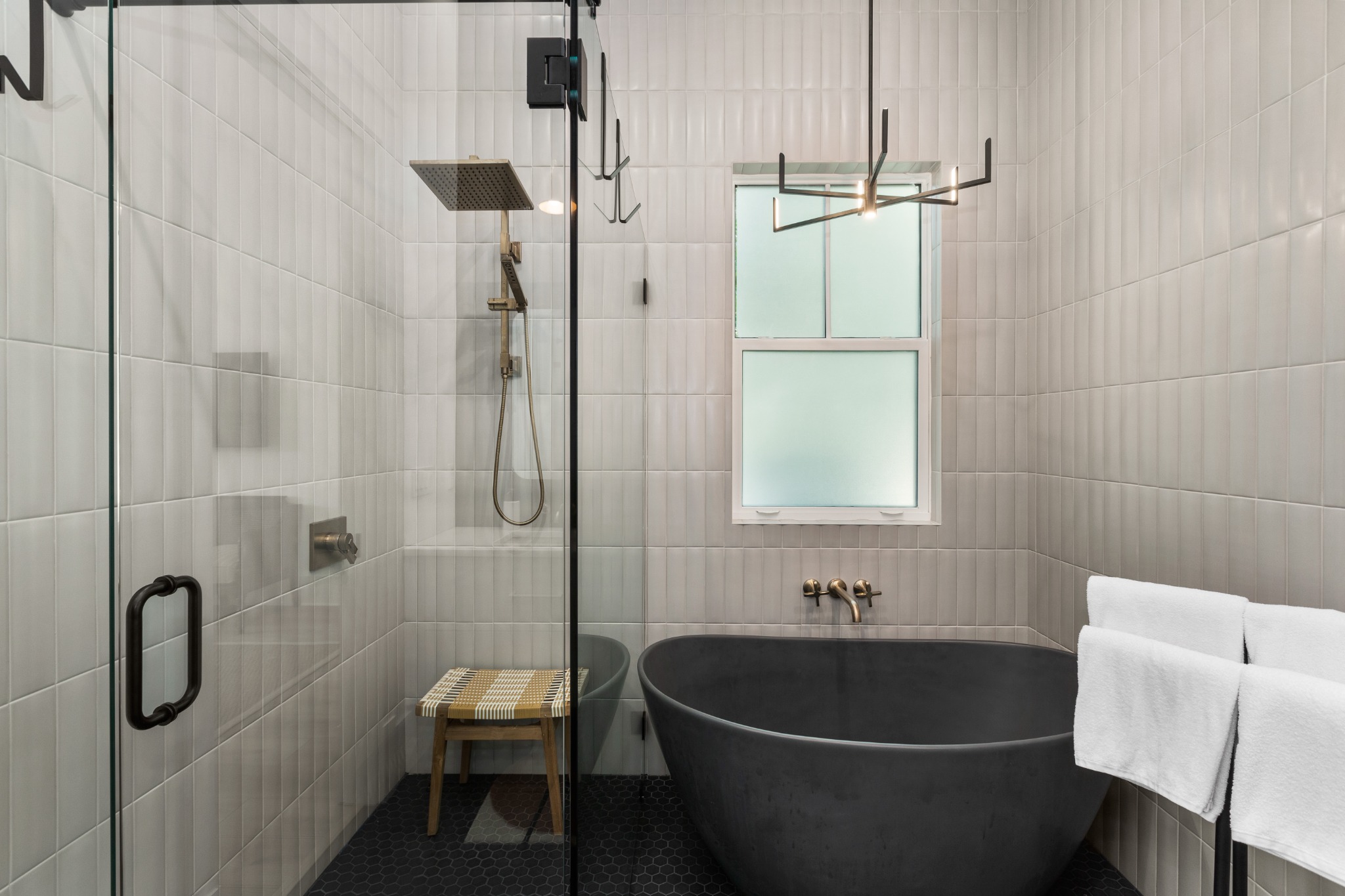 Bathroom soaking tub and glass shower