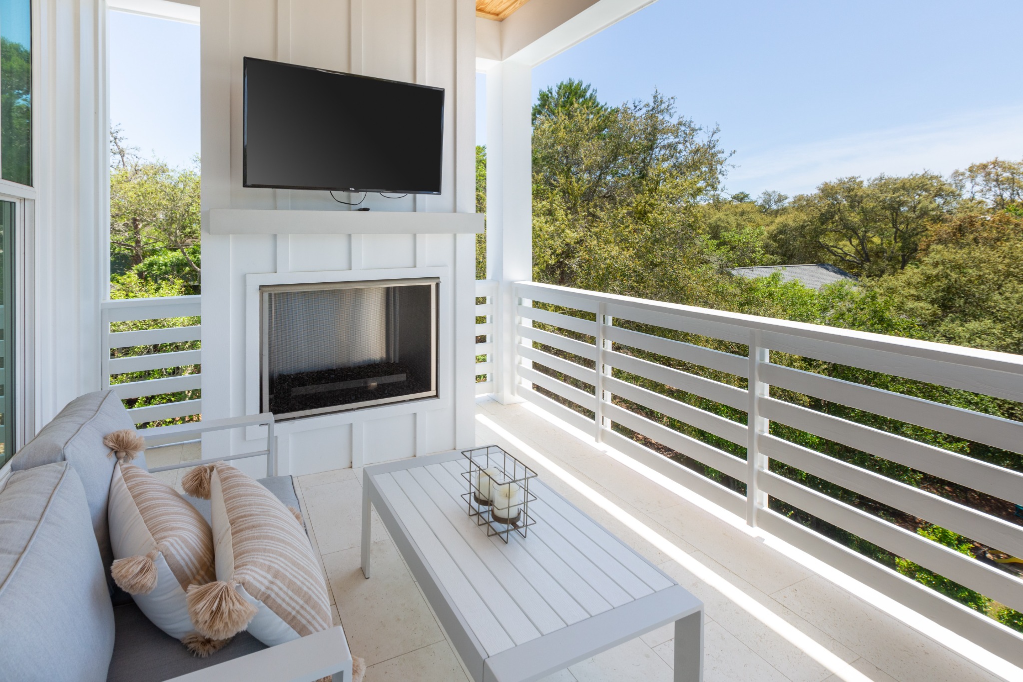 Upstairs covered porch with TV