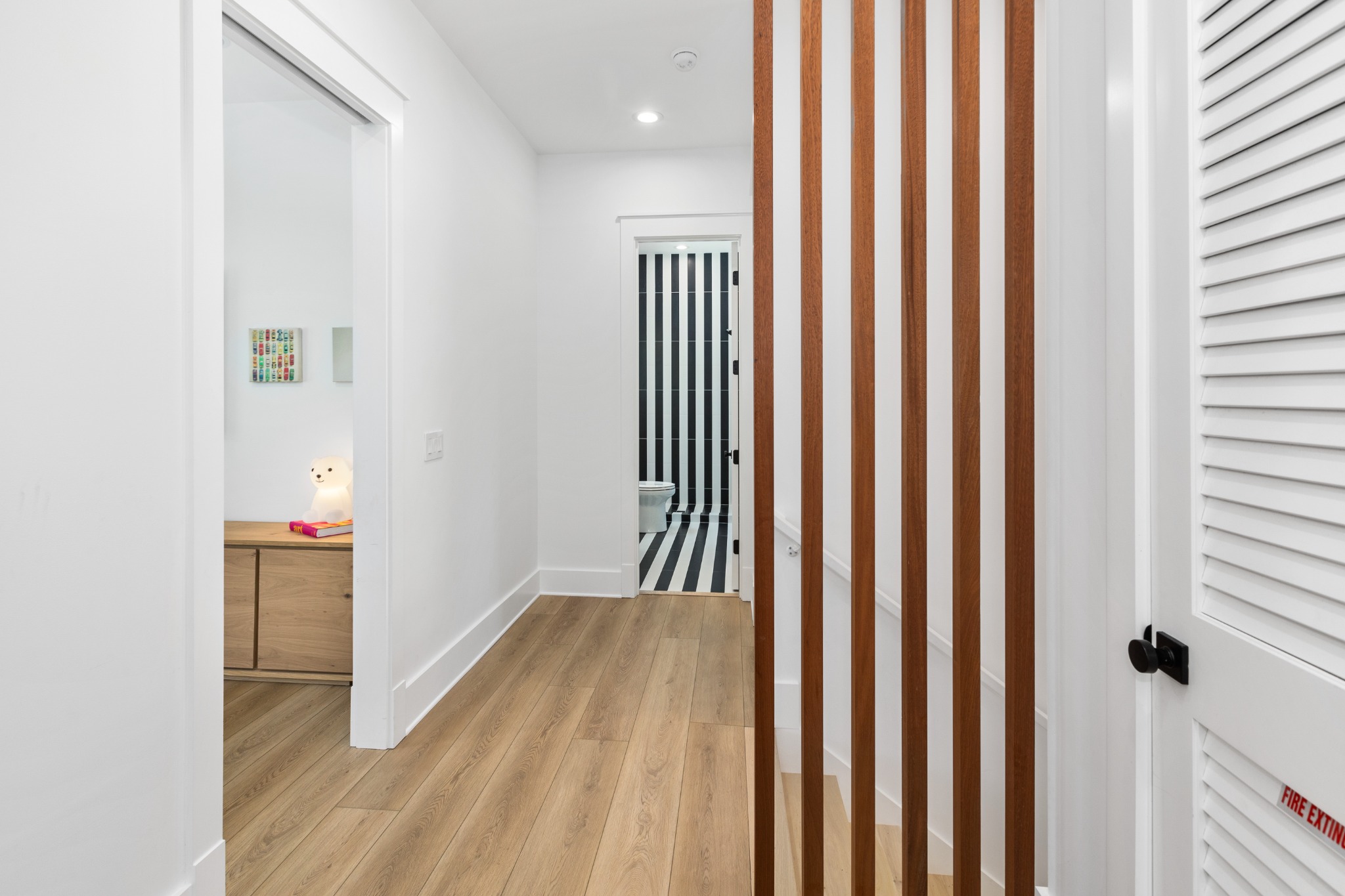 Hallway with wood floors