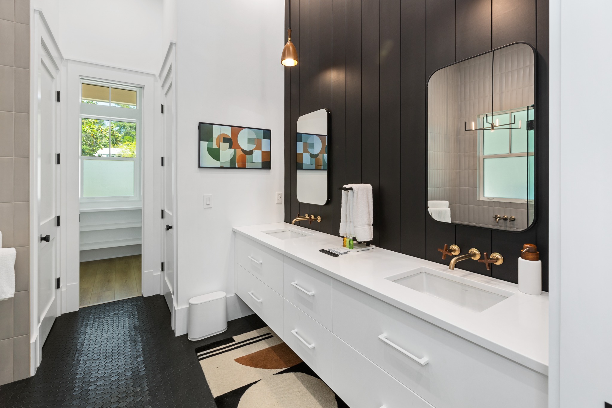 Bathroom with twin vanities and rainfall shower