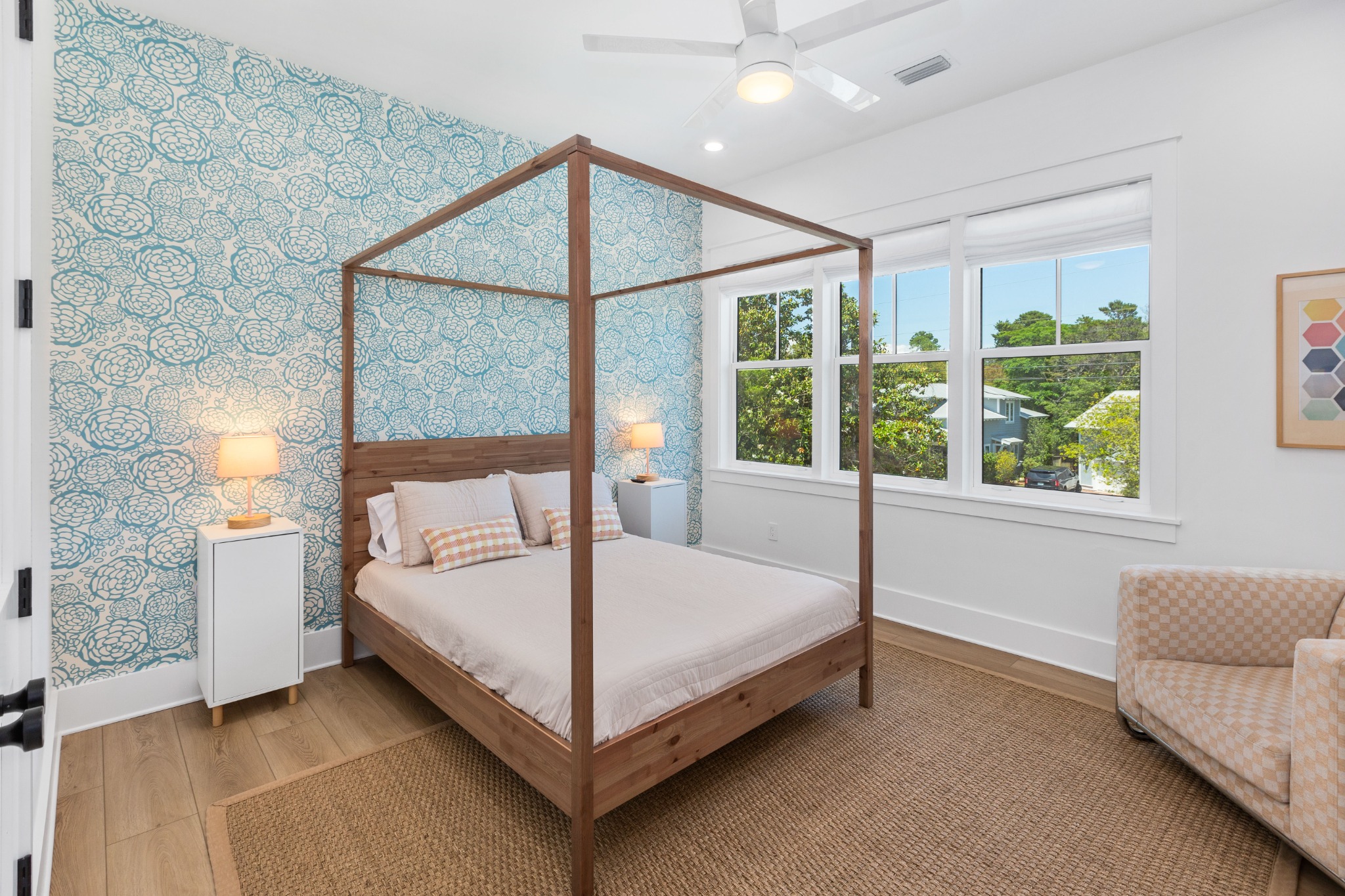 Canopy bed bedroom with botanical wallpaper