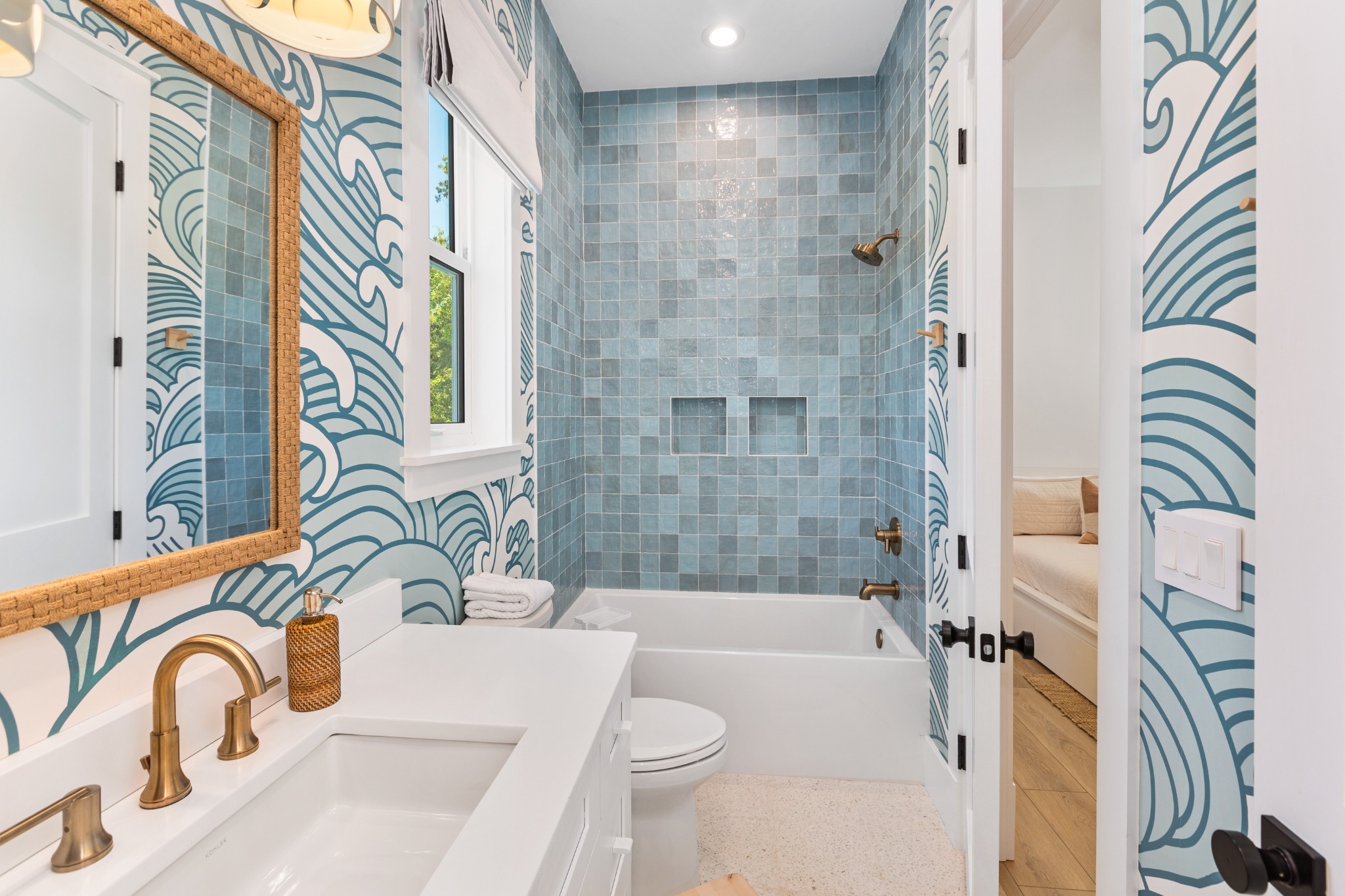 Bathroom shower with leaf-pattern wallpaper