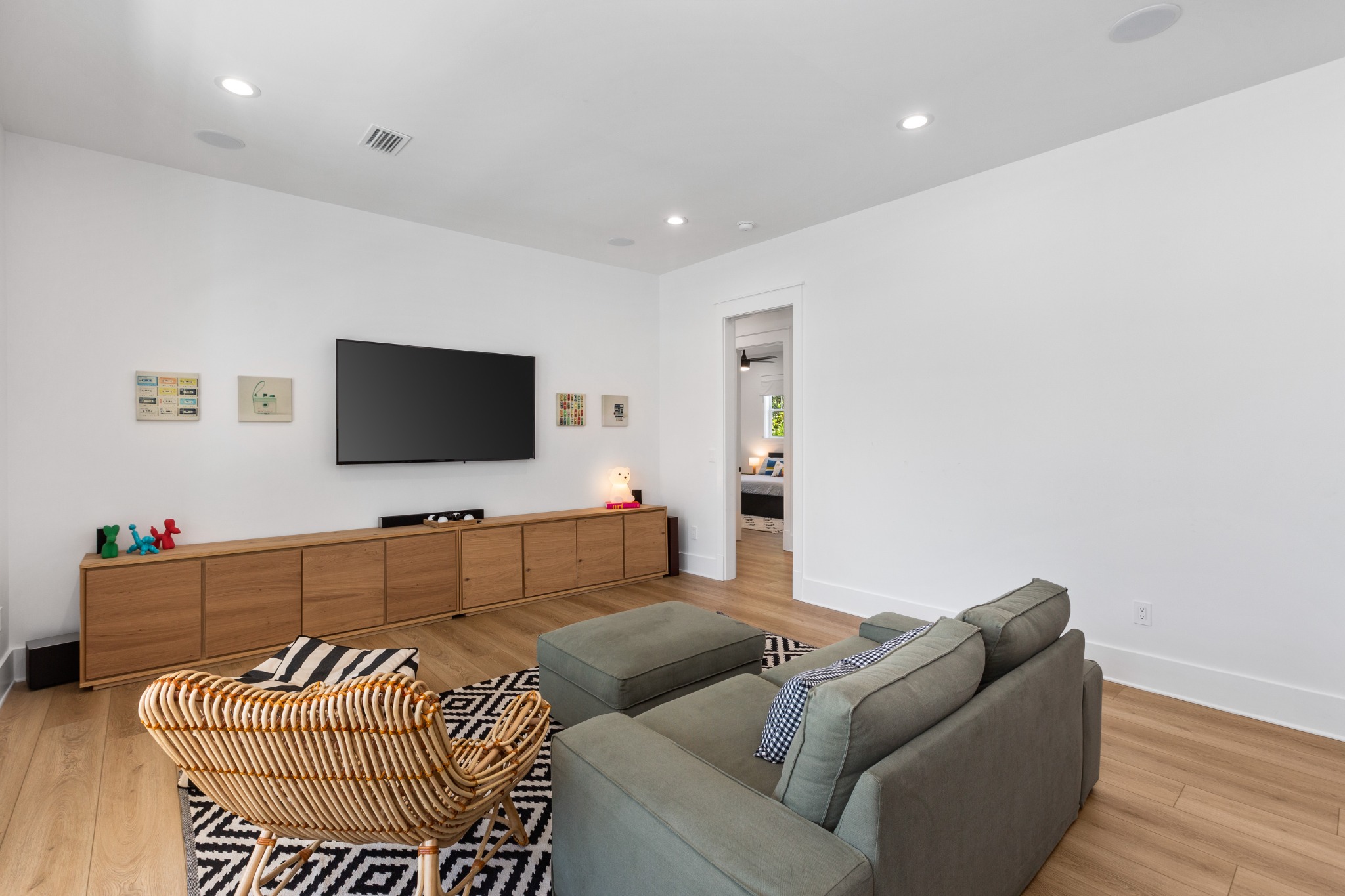 Family room with ceiling fan and natural light