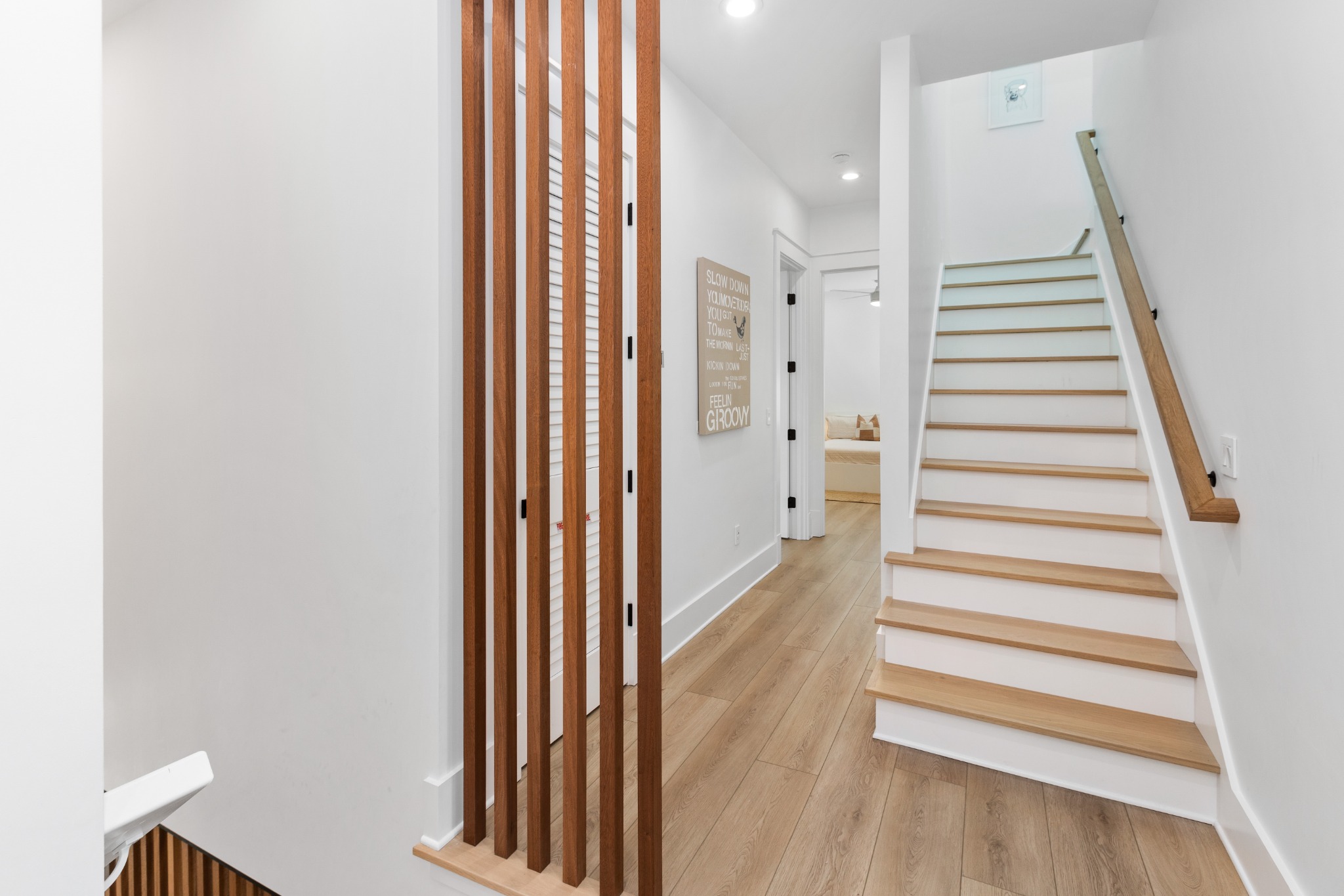 Stairwell with wood treads and modern railing
