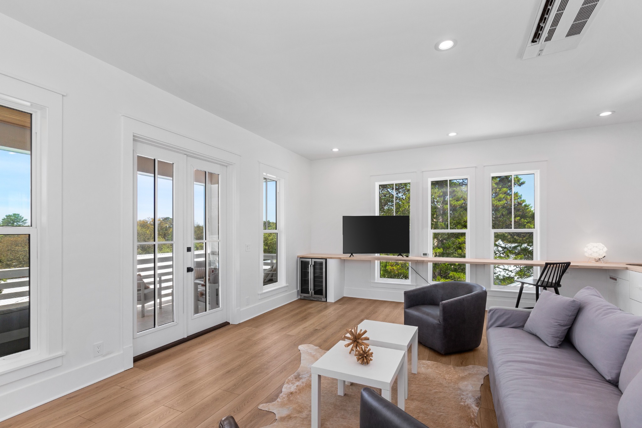 Lounge with neutral palette and window seats